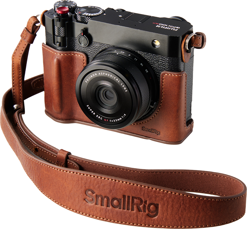 The FUJIFILM digital camera in the brown SmallRig 5268 Leather Case Kit for GFX100RF with matching neck strap can be seen in the light background.