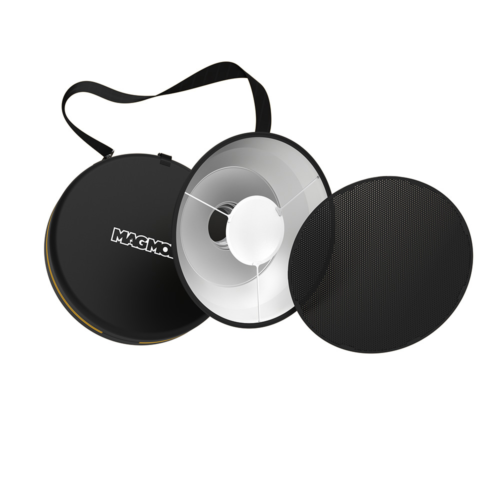 Magmod Beauty Dish XL 20 Pro Kit sisältää mustan kantolaukun, metallisen beauty dish -heijastimen ja irrotettavan mustan hunajakennoverkon, kaikki valkoisella pohjalla.