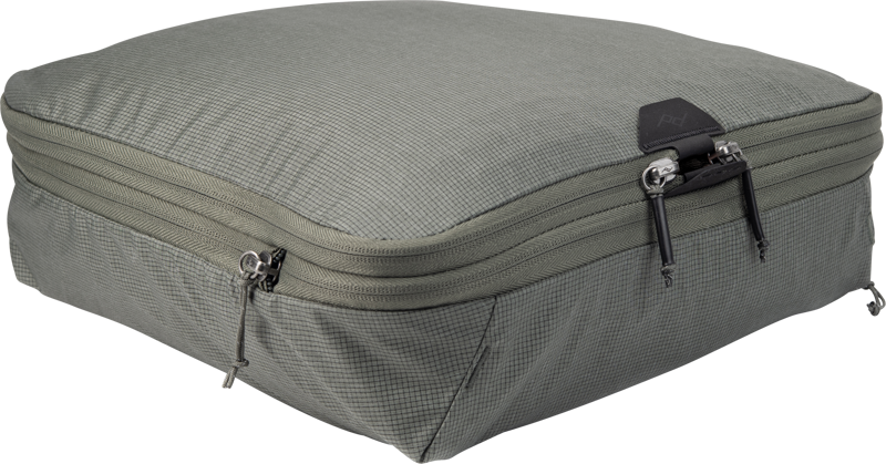 The Peak Design Packing Cube (Medium, Sage) is a rectangular organizer with a textured finish, double zipper and black top edge - perfect for keeping clothes or accessories organized in your luggage.
