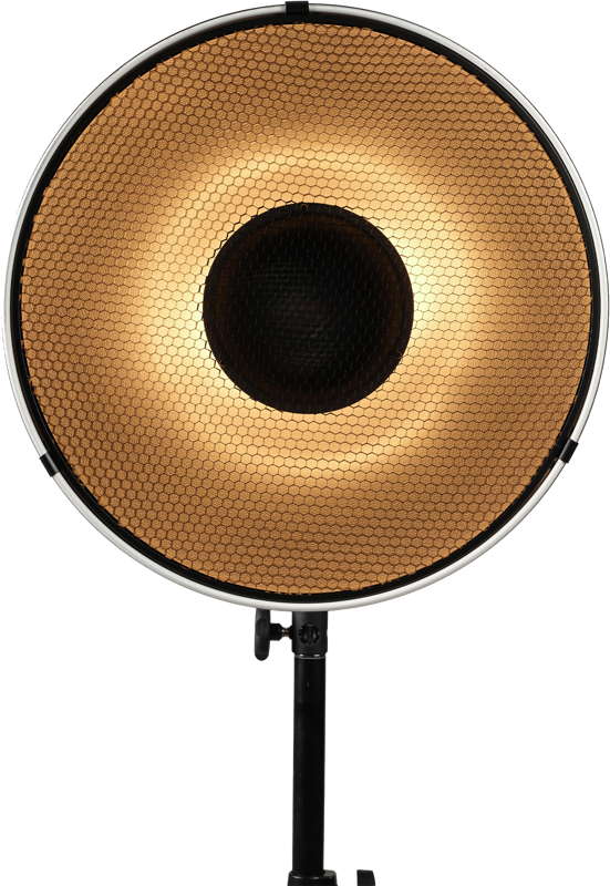 The Nanlite Beauty Dish 40 cm reflector with honeycomb diffuser emits a warm golden glow and is mounted on a black base against a white background.