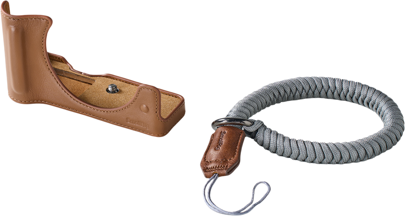 SmallRig 5432 Leather Half Case Kit for Canon EOS R50 V Brown and grey braided wrist strap with brown leather fastening, both with light coloured background.
