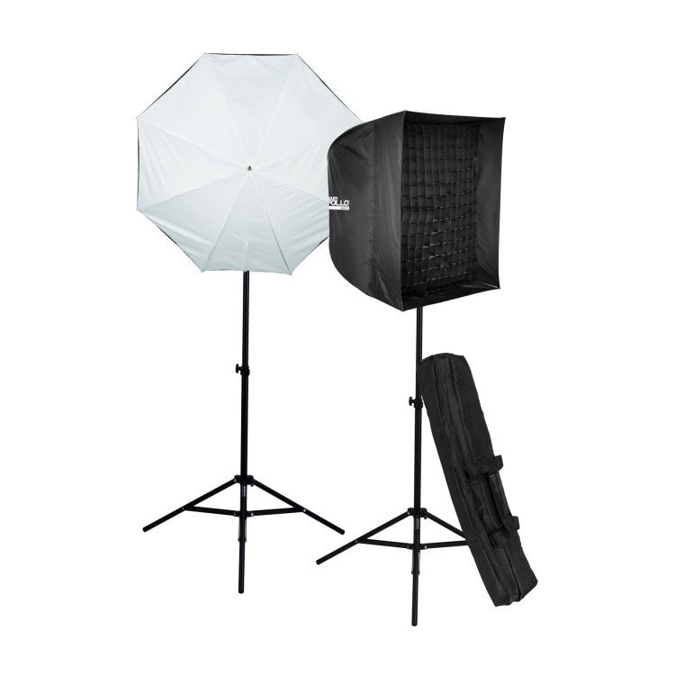 The Westcott Bob & Dawn Davis Perfect Pair Kit includes two studio lights on a tripod - one with a white umbrella diffuser and one with a black softbox - and a black carrying case, all on a white background.