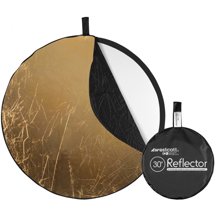 Kuvassa on Westcott Collapsible 5-in-1 Reflector Gold Surface (76 cm), jossa näkyy kultainen, valkoinen ja musta pinta. Sen vieressä on sen kompakti vetoketjullinen kantolaukku, jossa lukee "30 Reflector.