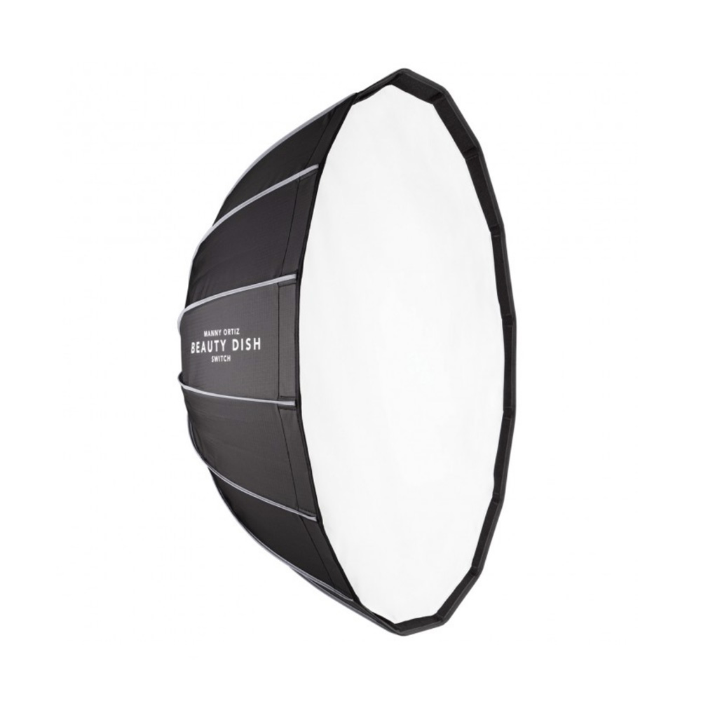 The Westcott Beauty Dish Switch by Manny Ortiz (91 cm, white interior) is a large, round softbox-style beauty dish for studio lighting with a black exterior, white diffuser and "Beauty Dish" printed on the side.