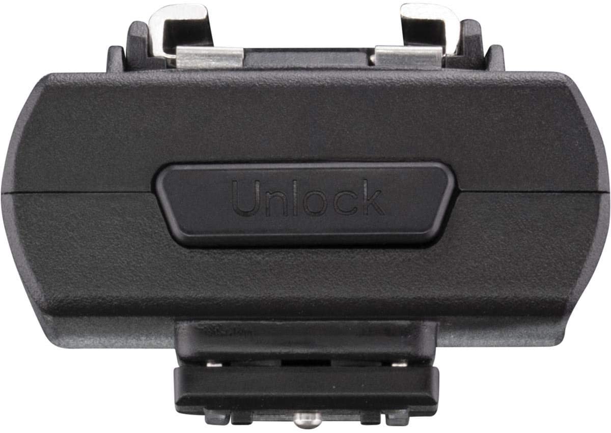 Front close-up of the black accessory for the Westcott FJ Wireless Adapter for Sony camera, with metal connectors and a button in the middle to unlock, against a white background.