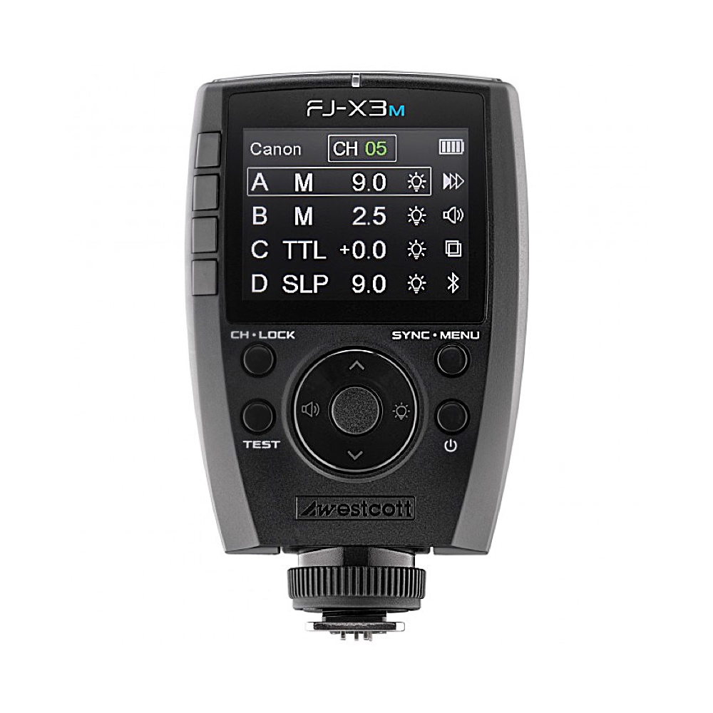 Westcott FJ-X3m Universal Wireless Flash Trigger for Canon -salamalaukaisimessa on musta runko, värinäyttö salamaryhmäasetuksille, kanavalle ja säätimille sekä useita painikkeita ja kiertovalitsin näytön alapuolella.