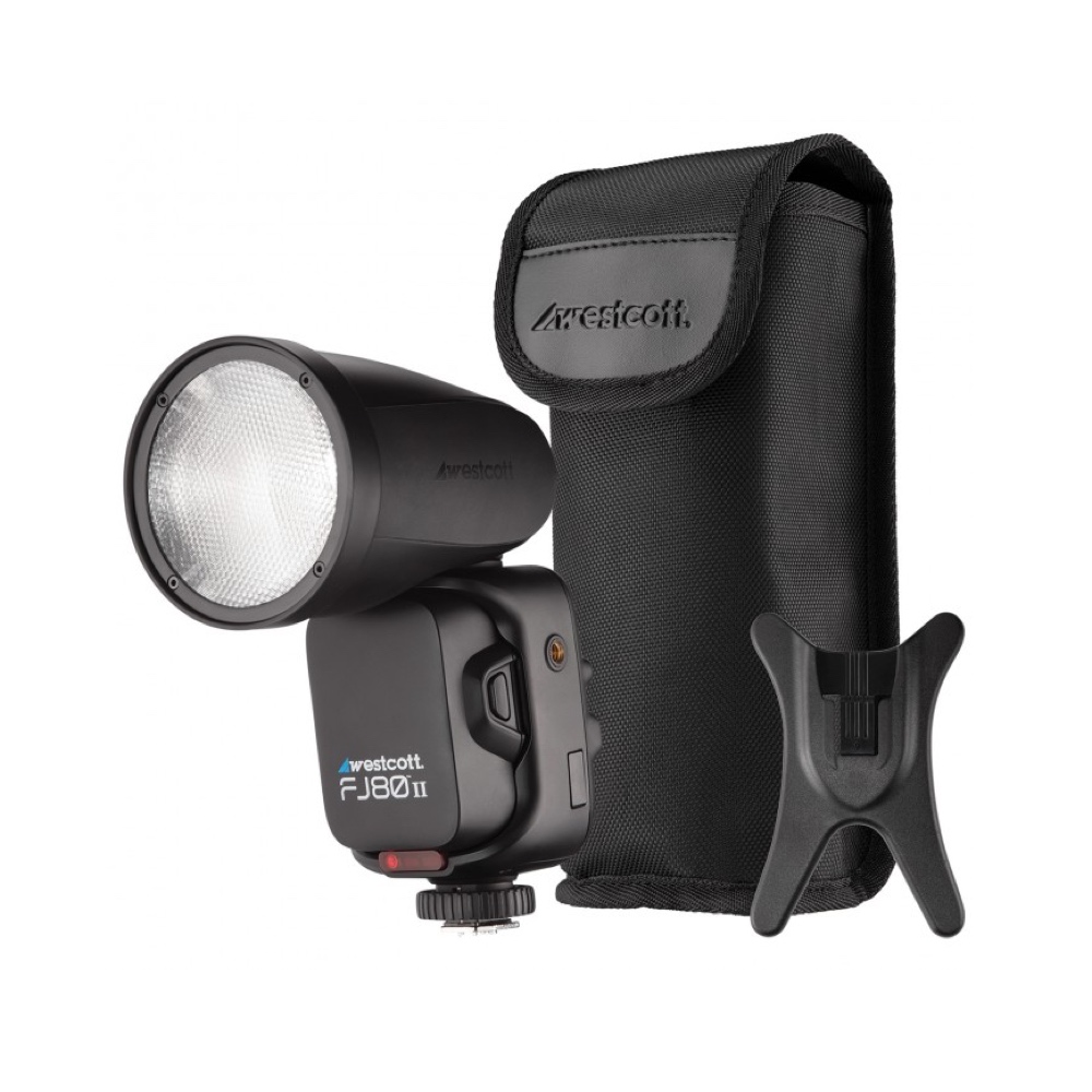 The Westcott FJ80 II M Universal Touchscreen 80Ws Speedlight in black, with matching carrying case and plastic stand, is presented on a white background.