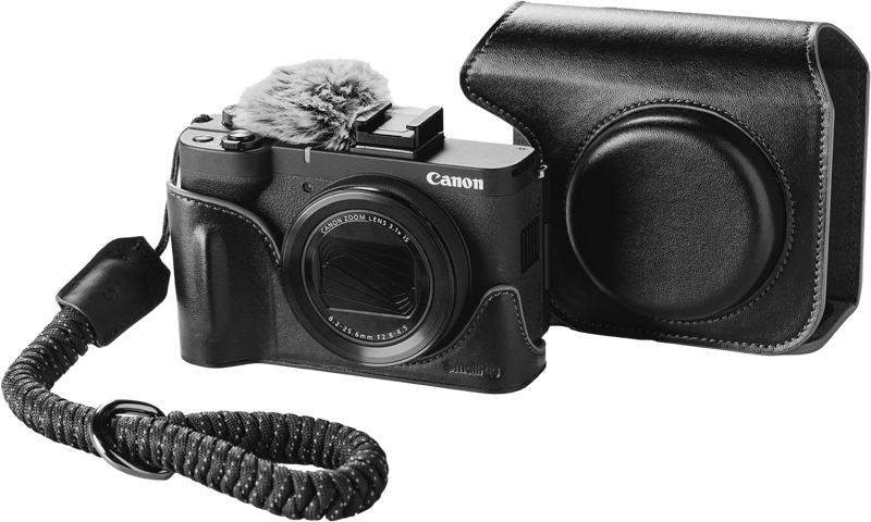SmallRig 5385 Leather case set for Canon PowerShot V1 Black with lens cover, top-mounted fluffy microphone and braided wrist strap next to it.