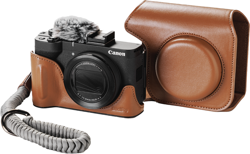 SmallRig 5385 Leather Case Kit for Canon PowerShot V1, brown, showing black Canon digital camera, hairy microphone, cover and braided wrist strap, shown on white background.