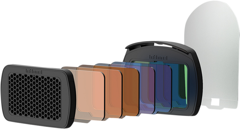 The Hähnel Module Light Effects Kit - flash equipment is presented in a line with coloured and transparent filters, a black filter holder, a honeycomb filter at one end and a large transparent filter at the other.