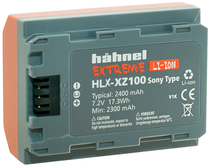 Harmaa Hähnel Battery Extreme Sony HLX-XZ100 / NP-FZ100 -akku, jossa on oranssit korostukset, merkintä 2400 mAh, 7.2V, 17.3Wh, sopii Sony-kameroihin, ja siinä on sertifiointi- ja varoitussymbolit.