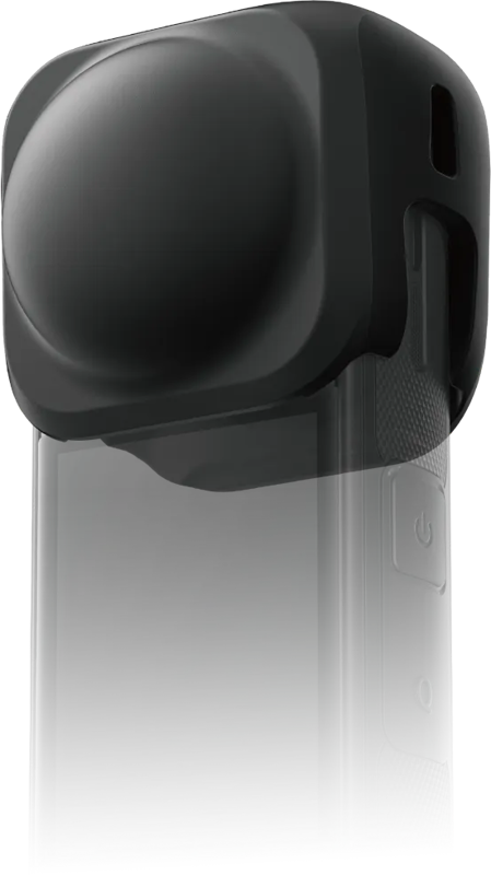 Close-up of the black Insta360 X5 lens cover with rounded lens cover, side buttons and textured handle with partially faded lower part.