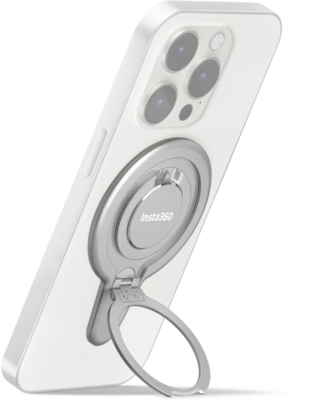 Valkoinen älypuhelin on nostettu pystyasentoon, kun Insta360 Flow 2 Pro Magnetic Phone Mount -puhelinkiinnike on kiinnitetty sen takaosaan, ja laajennettua kiinnikettä käytetään jalustana.