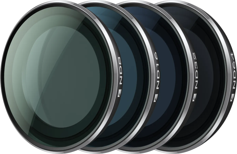 The Insta360 GO 3S ND Filter Kit contains four circular lens filters (ND8, ND16, ND32, ND64) tinted to different darkness levels and arranged in a row.
