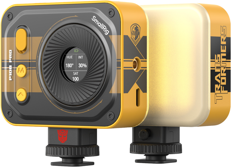SmallRig 5511 Vibe P108 Pro mini LED-videovalaisimessa - BumbleBee Edition on keltainen ja musta muotoilu, Transformers-brändäys, ohjauspainikkeet, säädettävät säätönupit ja digitaalinen näyttö värisävyn, voimakkuuden, kylläisyyden ja värilämpötilan asetuksille.