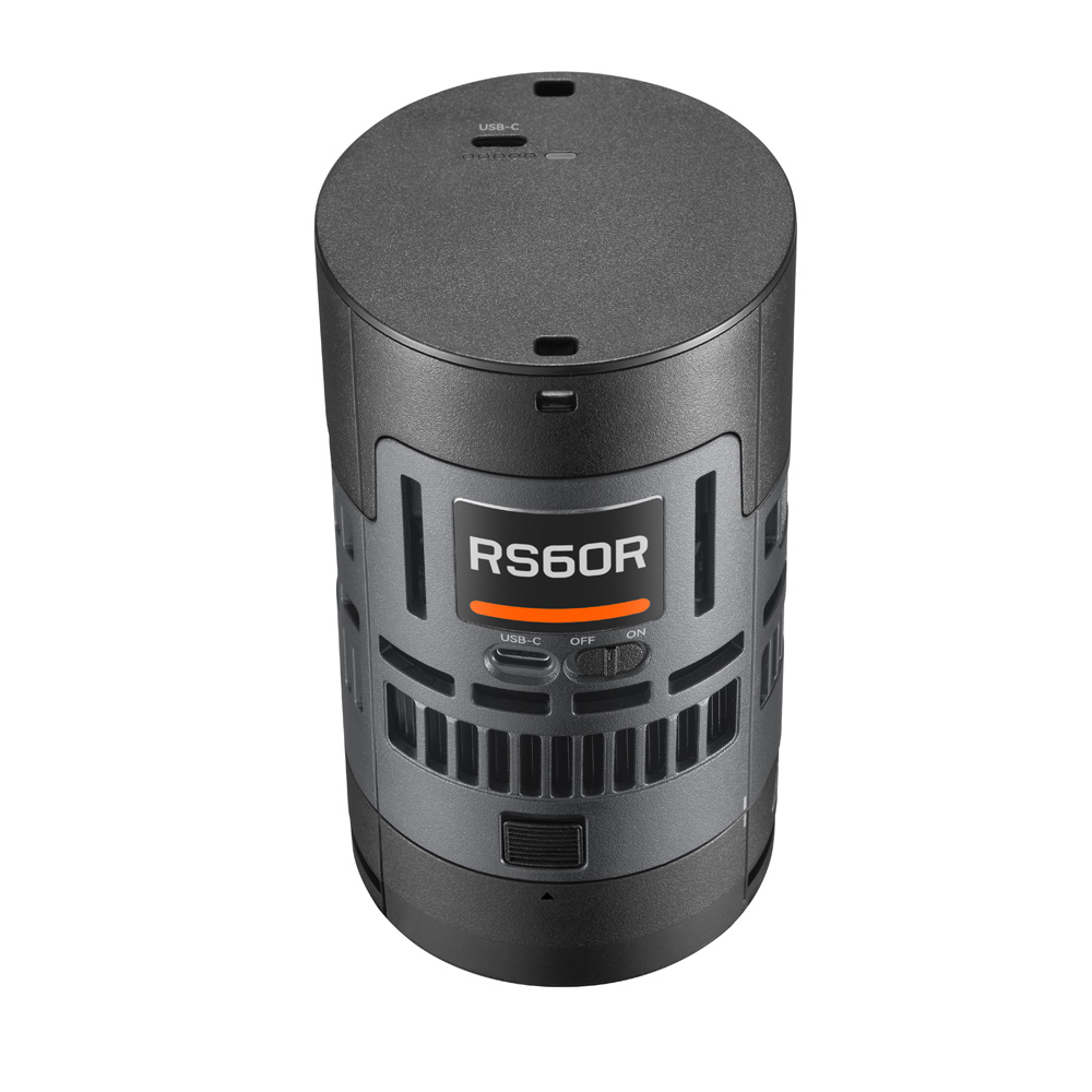 The Godox Litemons RS60R RGB LED luminaire is a black cylindrical electronic device with a small display, buttons, vents and a USB-C port at the top. It has a sleek, modern industrial design.