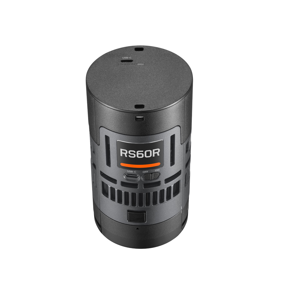 Godox Litemons RS60R RGB LED Light 1 Light Kit, lieriön muotoinen musta elektroninen laite, jonka etupuolella on painikkeita ja tuuletusaukkoja, näkyy valkoista taustaa vasten.